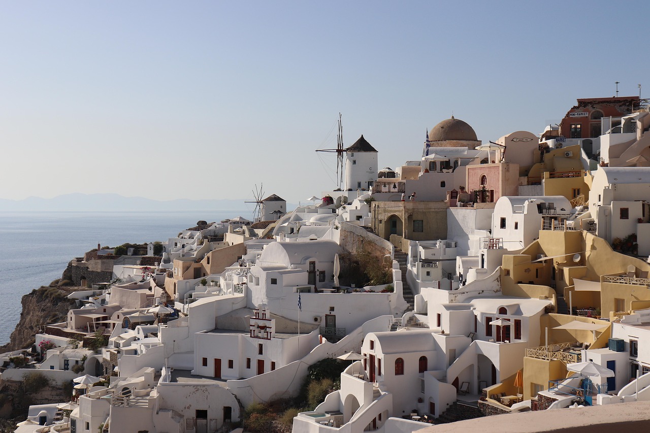 Santorini sunset with white buildings and blue domes